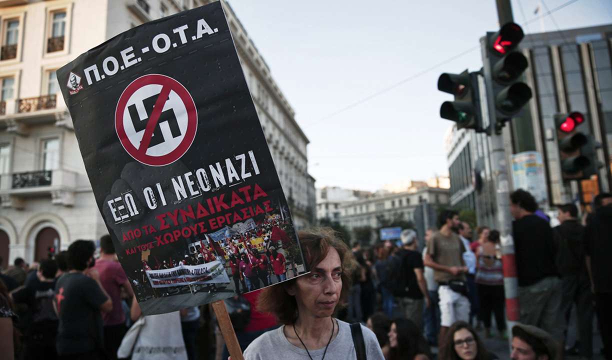 A protester holds a banner during an anti-fascist rally in Athens